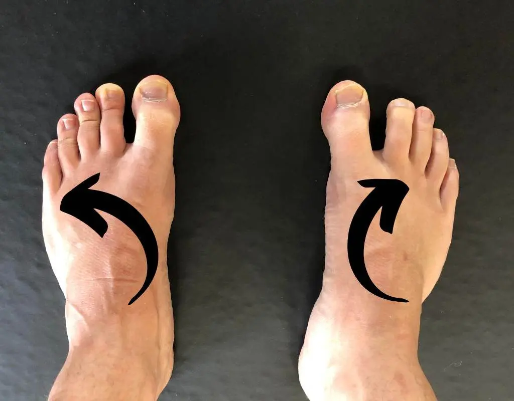 Screw feet into ground while squatting.
