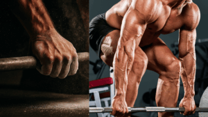 Two powerlifters prepare for deadlift with the barbell still on the ground.