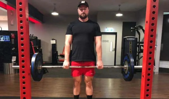 Lock your hips and knees at the same time at the top of a deficit deadlift
