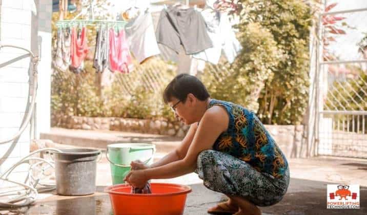 Asian squat while doing laundry