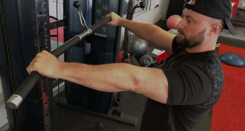 Bring up your shoulder, tricep, and pec strength to break through bench press plateaus. Photo by Powerlifting Technique.