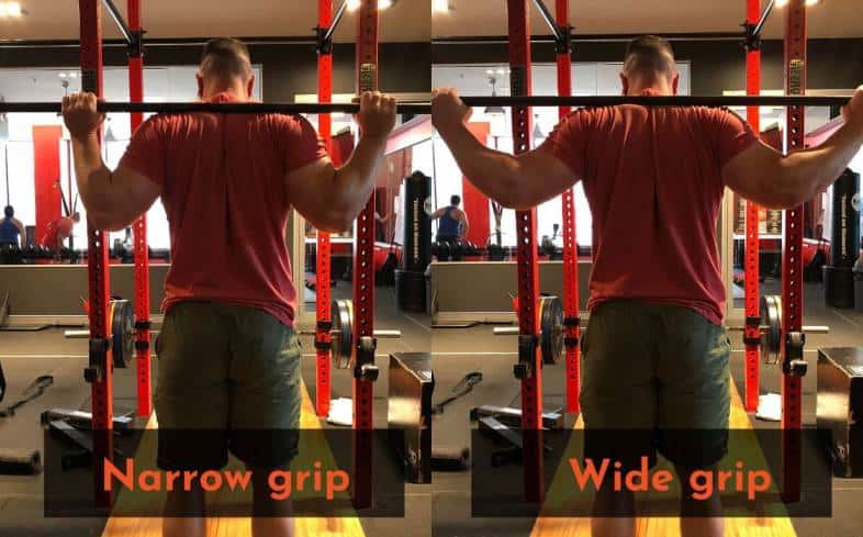 Use a wider grip to help fix shoulder pain while squatting
