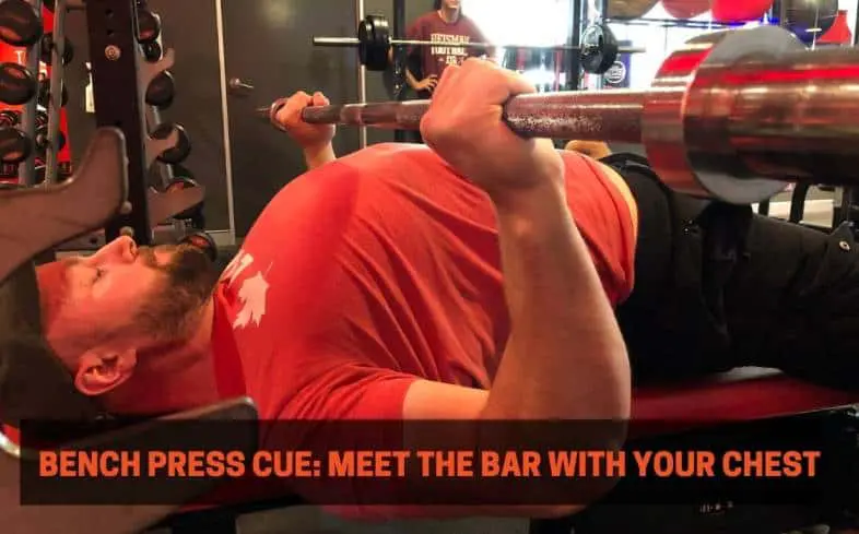 Bench press cue showing the chest meeting the barbell 