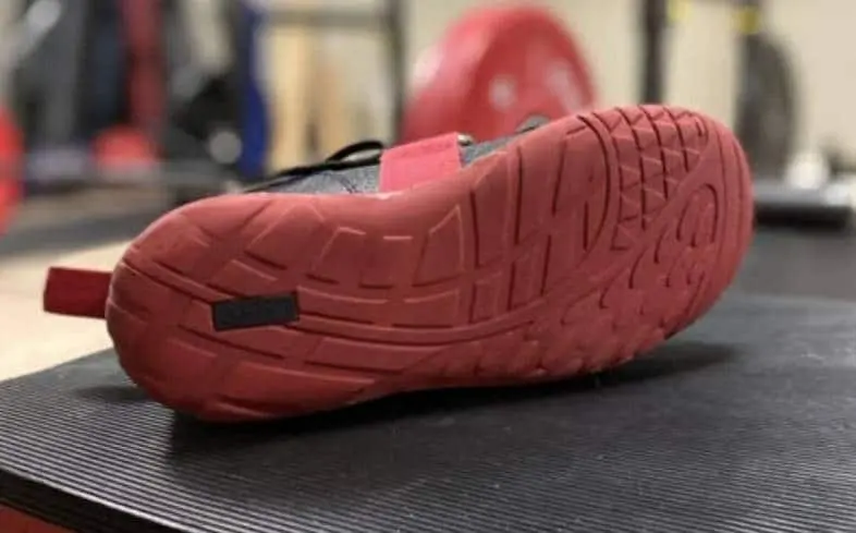 The sole of a squat shoe for deadlift, which are more likely to cause a lifter's feet to slide on the floor.