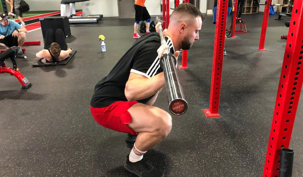 pause squats is an effective way to build tension in the bottom of the squat is to implement exercises that increase the time under tension