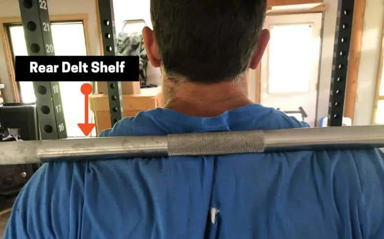 rear delt shelf is a natural place for the barbell to sit for the low bar squat