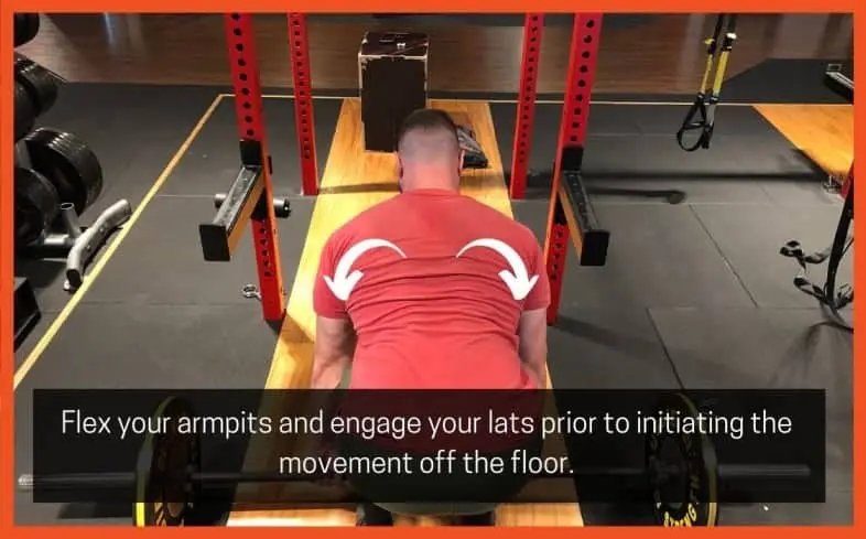 the cue of “flexing” your armpits is to ensure that your lats are tight throughout each stage of the movement, but in particular, the mid-range