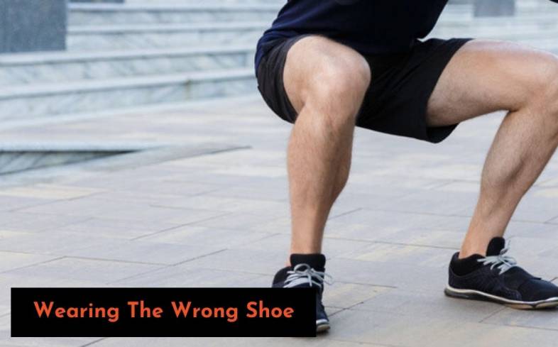 Wearing the wrong shoe can cause your heels to rise in the squat