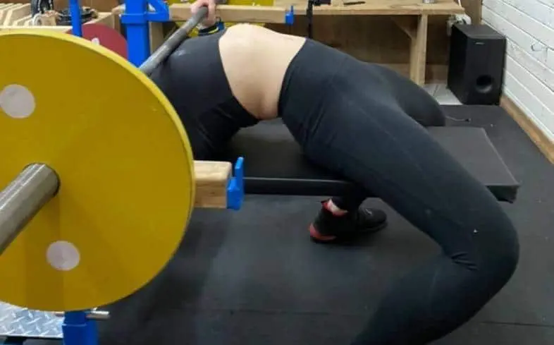 Squeeze the bar and engage leg drive by pushing the floor in the direction of where your feet point