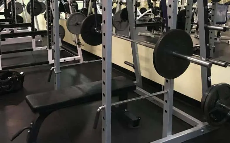 place the bench on the inside the four posts of the power rack