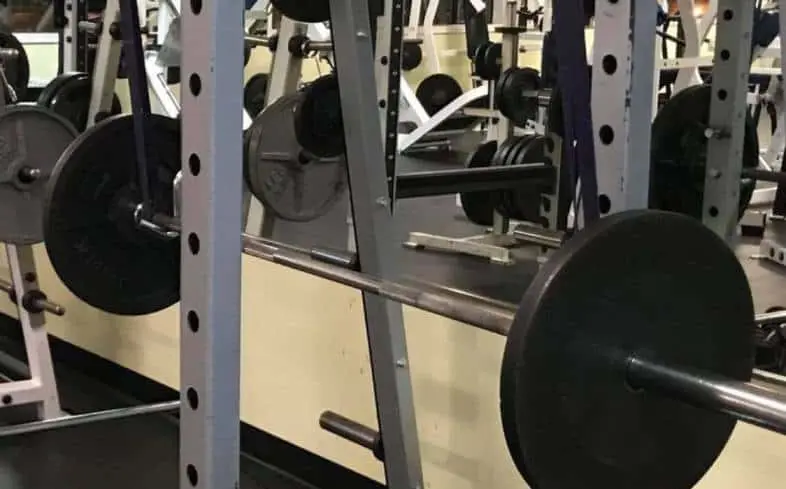 place the bottom of the band around the bottom of the barbell