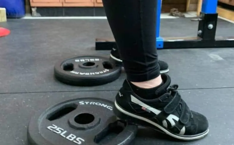 how to squat with plate under your heels