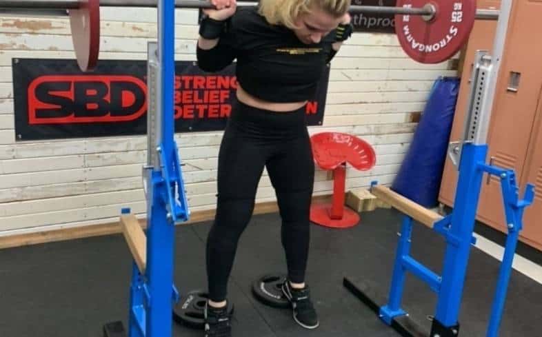 why do lifters squat with plates under heels