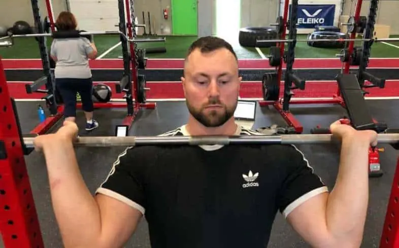 widening your hands and grabbing the bar with 2-3 fingers wrapped under the barbell