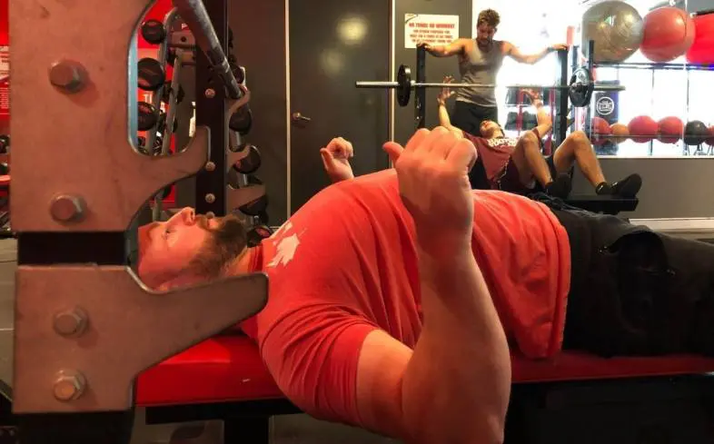 Retracting the shoulder blades is a crucial step when setting up the bench press.
