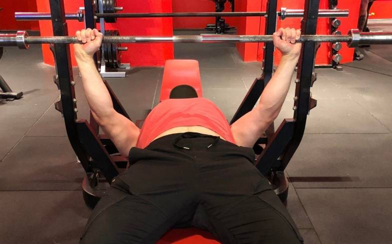 the ideal bar path for the bench press is actually a “J” shape 