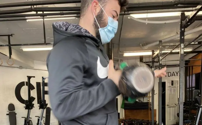 keep the kettlebell close to maintain control over the kettlebell by reducing the arc of the kettlebell as it travels