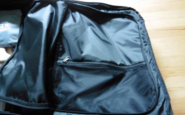 on the inner flap of gonex rolling duffel bag, there’s a large zippered pocket 