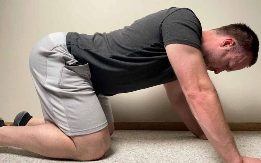 The end position for the capsule stretch. You can use your hands to continue to push backwards, resulting in a greater stretch to the hip capsule.