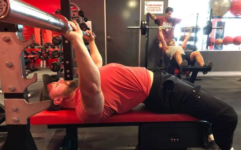 to feel the pecs while benching we need to ensure that we are getting full range of motion