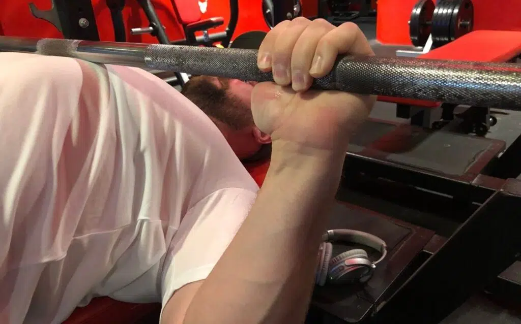 maintain control off of the bottom position and minimize the use of momentum to elevate the bar