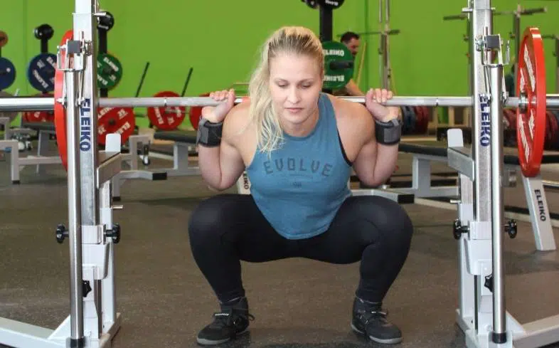 maintain tension in the bottom position of the squat in order to feel the glutes