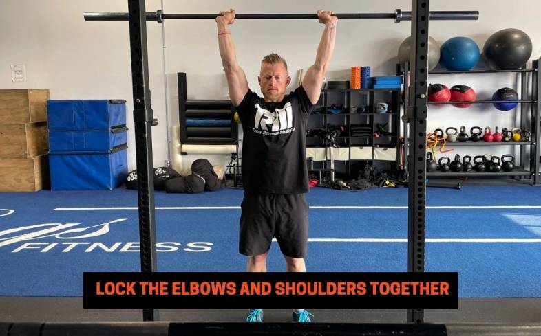 overhead press cue 12 - lock the elbows and shoulders together
