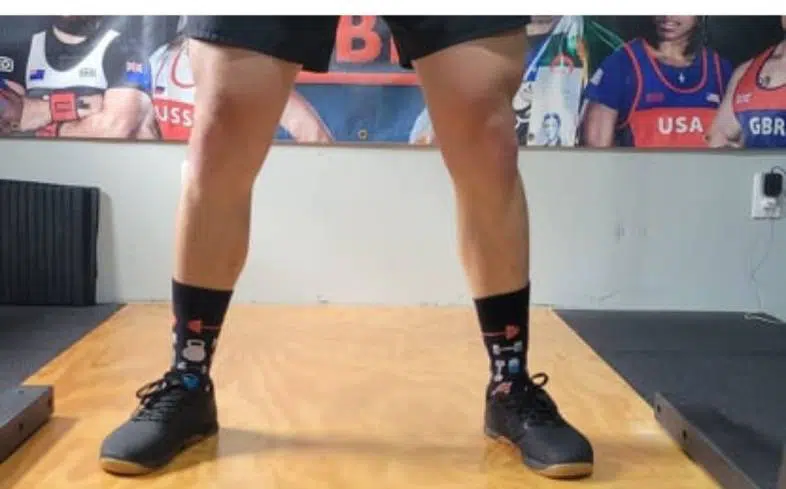 turning the toes outwards will help us feel the glutes more in a squat