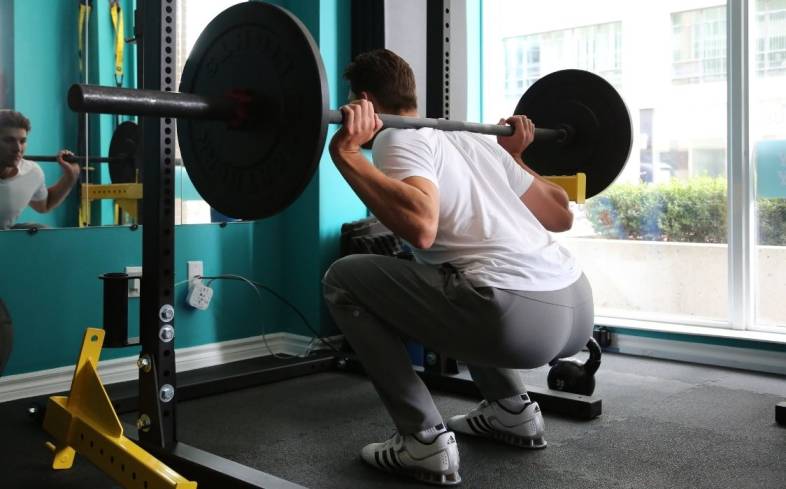 squatting reps need to take into account total volume