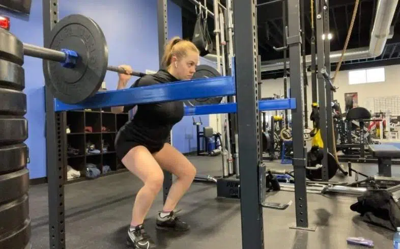 The Anderson squat is performed from the bottom position with the bar at a dead stop. 
