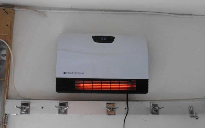 How can you stay safe using a heater in your garage?