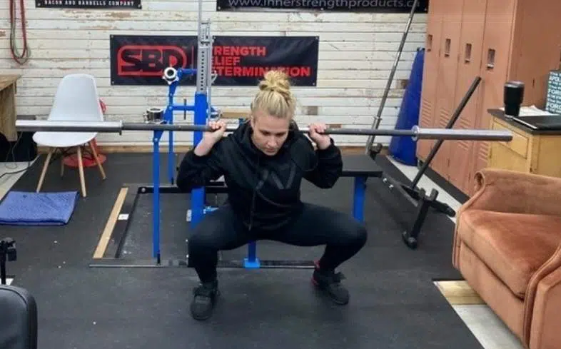 Steinborn squat step 4: Sit into the squat