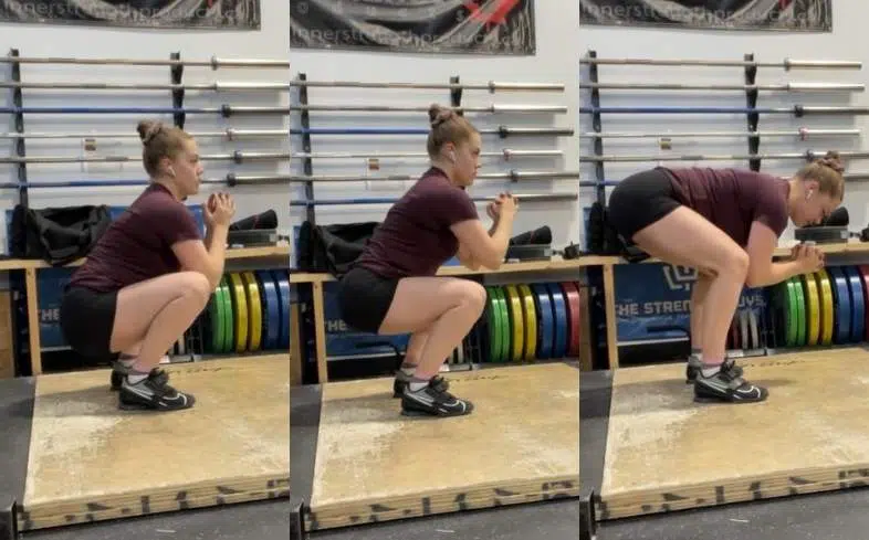 Step 2 on how to do the frog squat - drive the glutes upwards