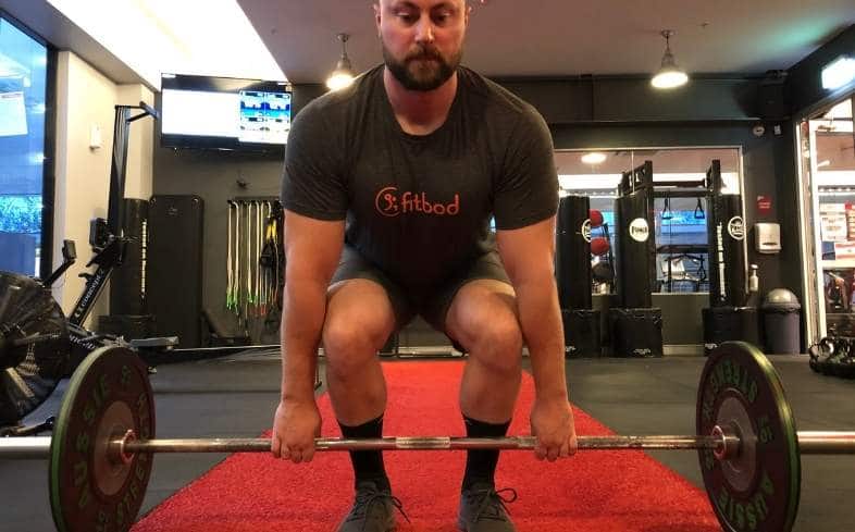 doing deadlifts and holding a heavy barbell below your waist with your own bare hands is one of the best ways to improve your grip strength