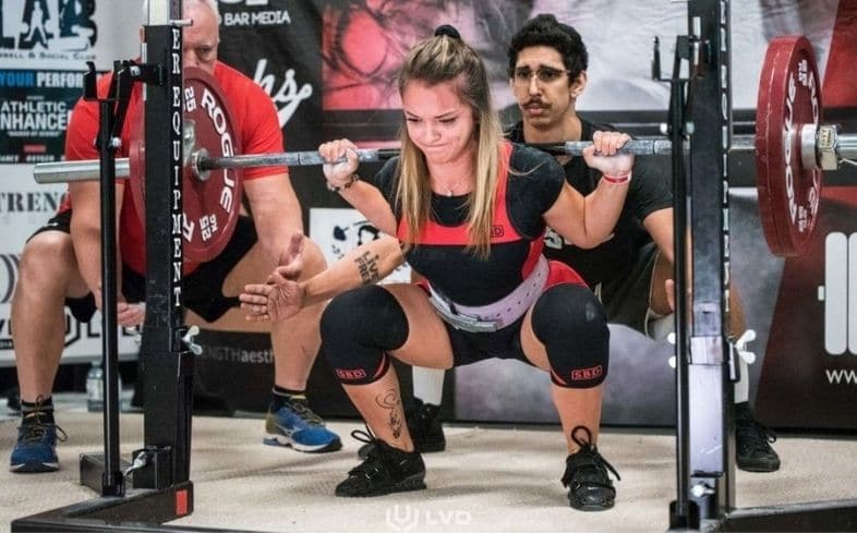 How do you spot a female doing squats?