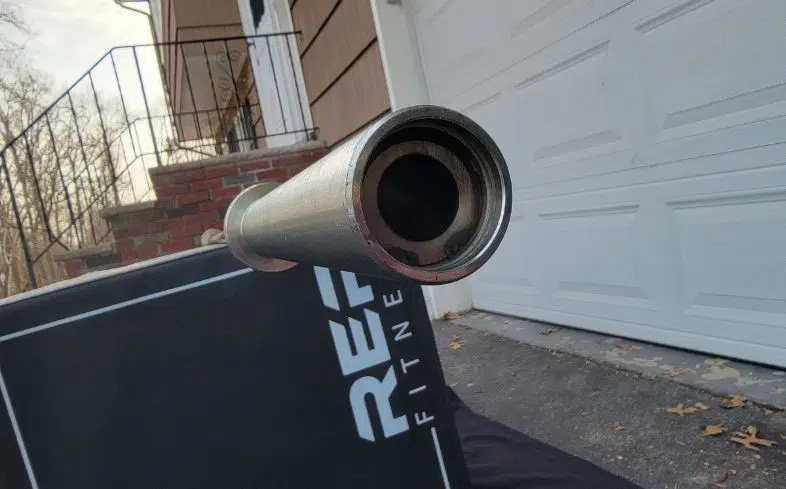 How to do barbell sleeve replacement: Tap on the end of the sleeve a few times to get the endcap out. With the snap ring pliers, remove the inner snap ring.