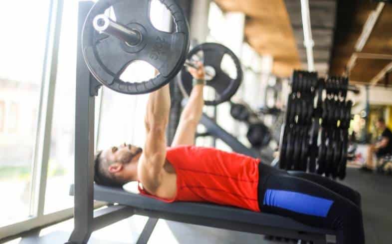 man doing bench press