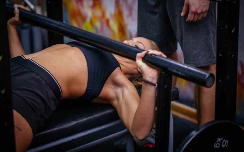 woman doing bench press