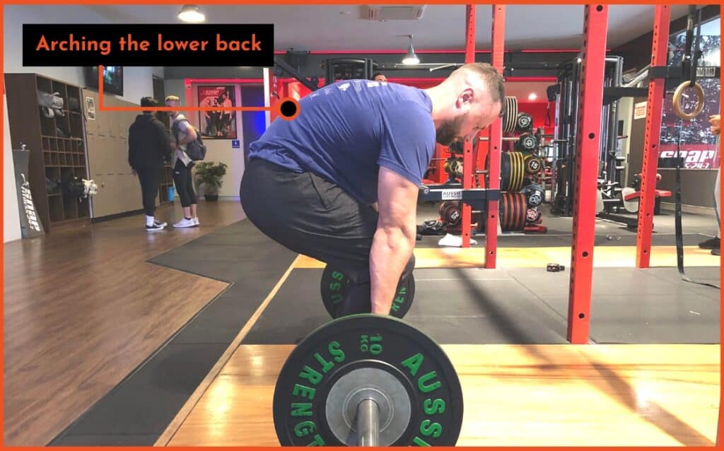 arching the lower back