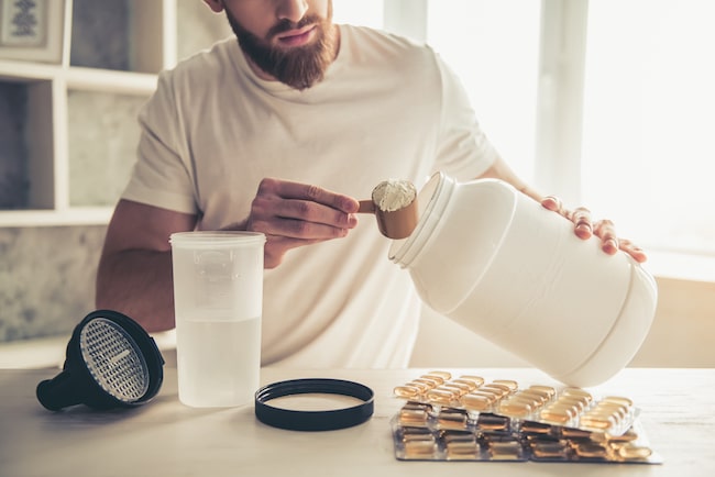 Man with sport nutrition creatine