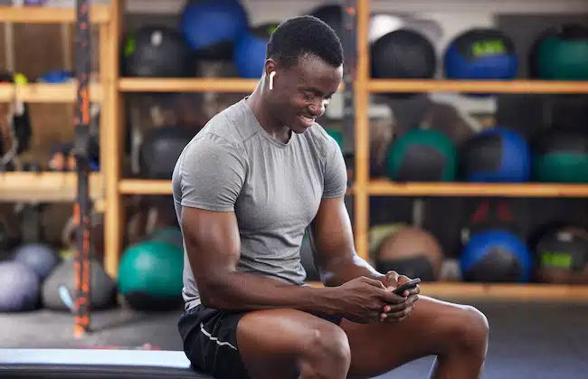 phone-fitness-and-black-man-in-gym-training-work-2023-02-15-00-22-37-utc