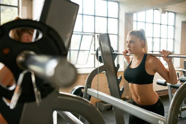 Woman-doing-squats-in-gym-2021-08-26-19-58-05-utc copy