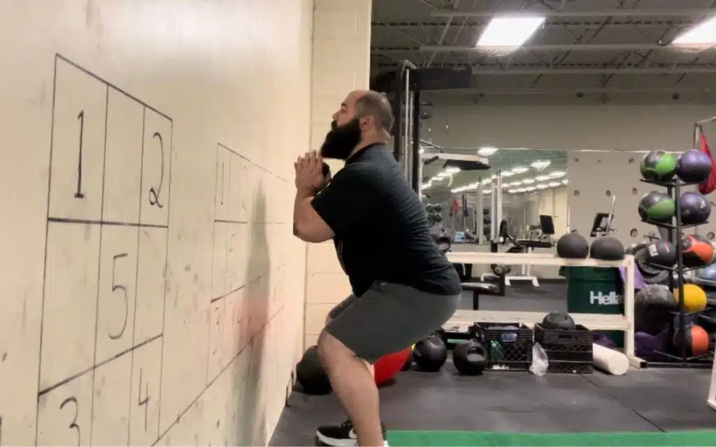 wall-facing goblet squat