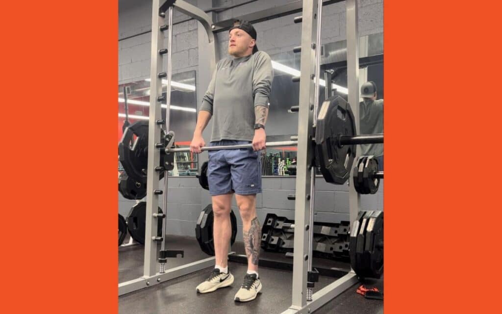 Muscles Worked During smith machine shrug, taken by Jake Woodruff, Strength Coach