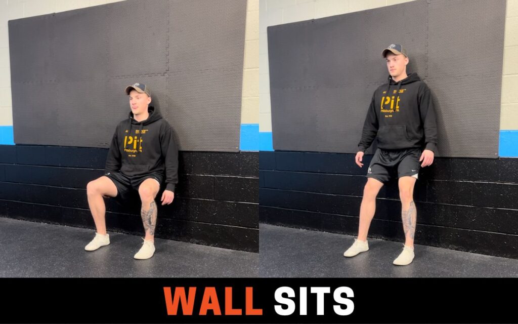 Wall Sits is one of the best leg extension alternatives, taken by Jake Woodruff, Strength Coach