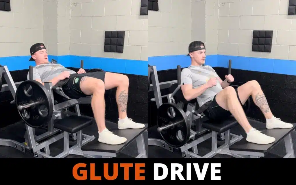 Athlete performing a glute drive on a machine with full hip extension at the top of the movement
