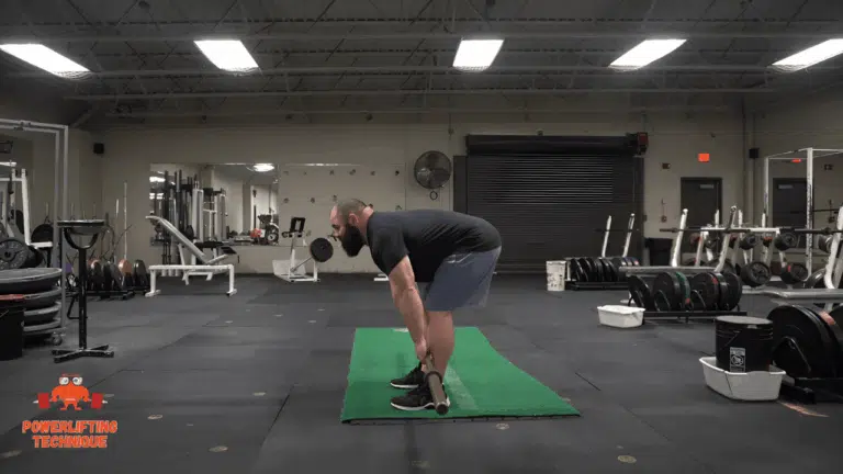 The bottom position of the Romanian Deadlift.