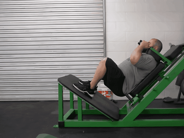 Hack Squat: Demo, Muscles Worked, and Programming