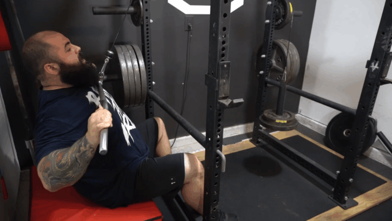 A professional strength coach shows how to do lat pulldowns with proper form.