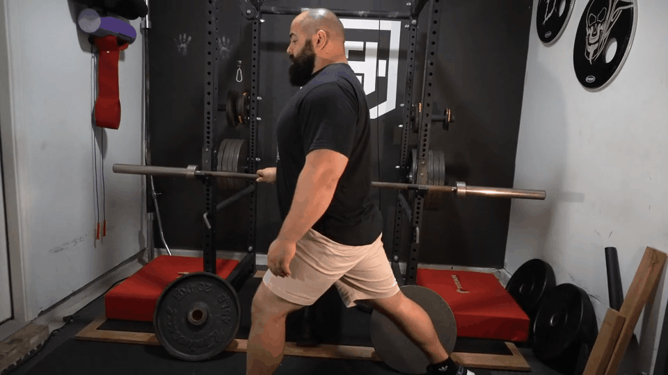 A strength coach does split squats.